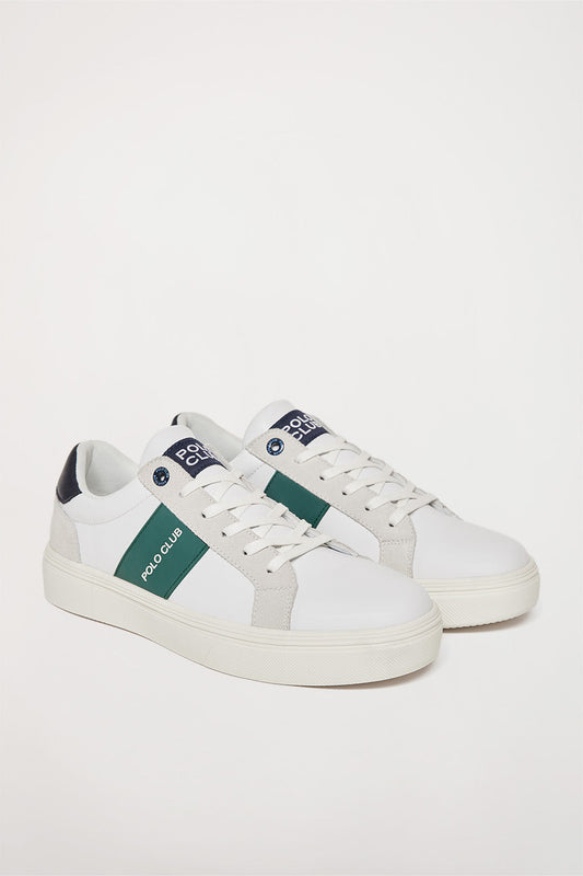 Klasyczne białe skórzane buty sportowe z kontrastującym elementem w kolorach niebieskim i zielonym