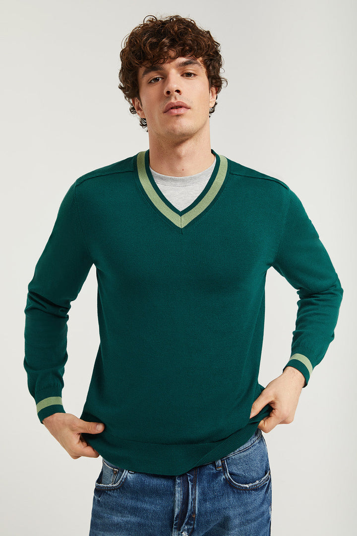 Blue V-neck knit jumper with detail on sleeve