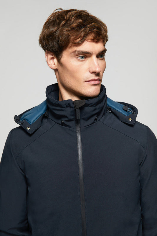 Navy-blue technical coat with detachable hood