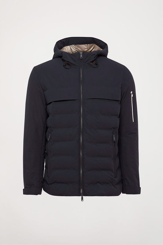 Navy-blue hooded puffer jacket with diamond-shaped patch on sleeve