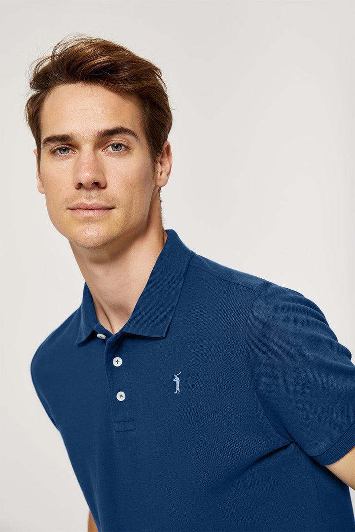 Indigo-blue pique polo shirt with three-button placket and contrast embroidered logo