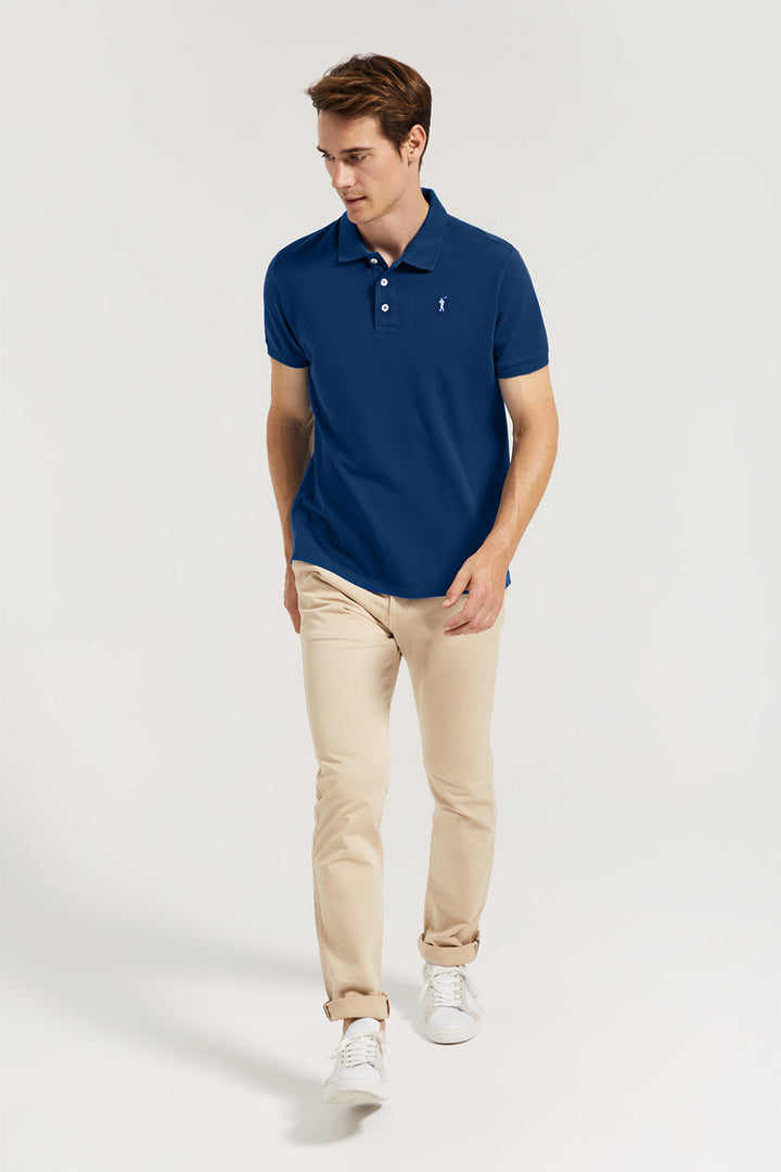 Indigo-blue pique polo shirt with three-button placket and contrast embroidered logo