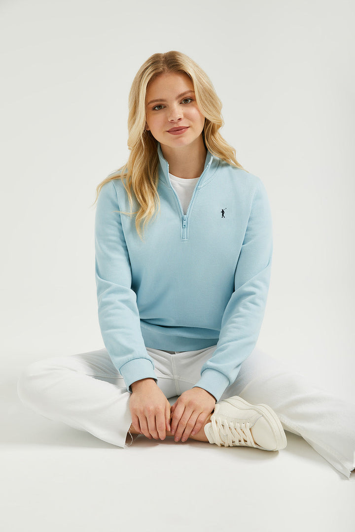 Sky-blue half-zip sweatshirt with Rigby Go logo