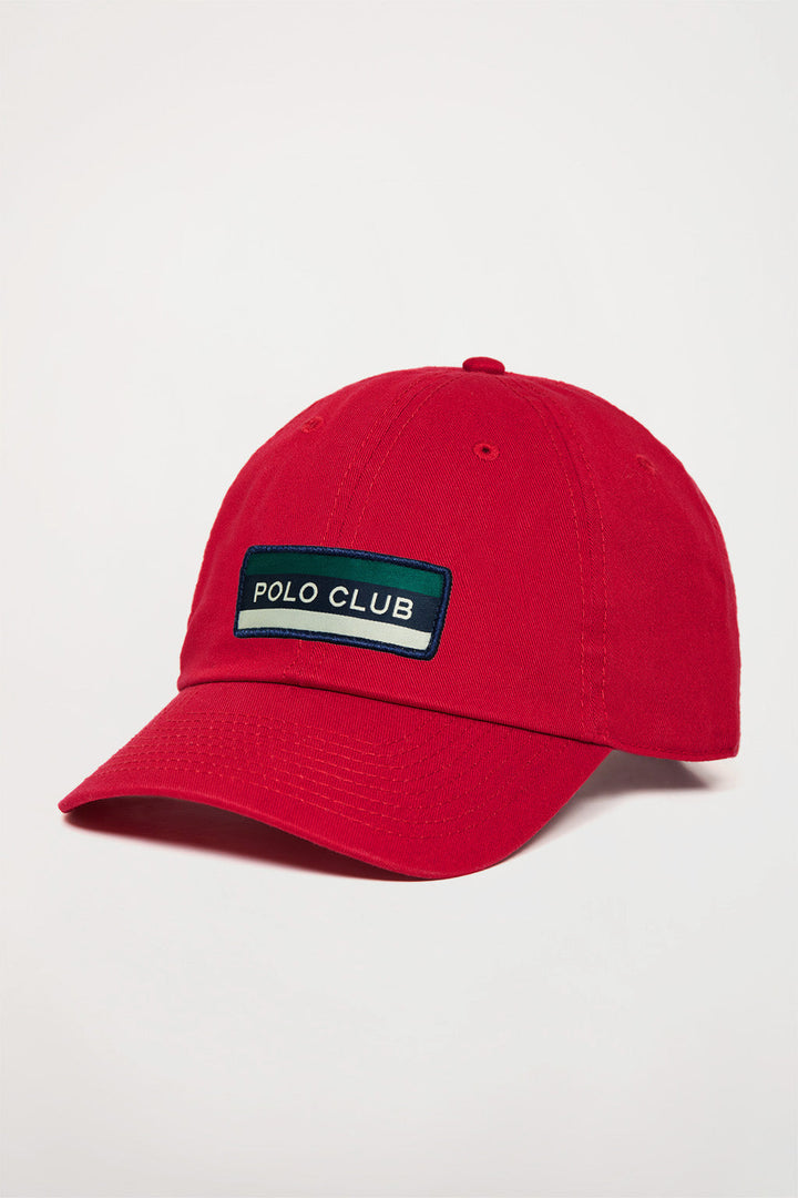 Red baseball cap with branded patch
