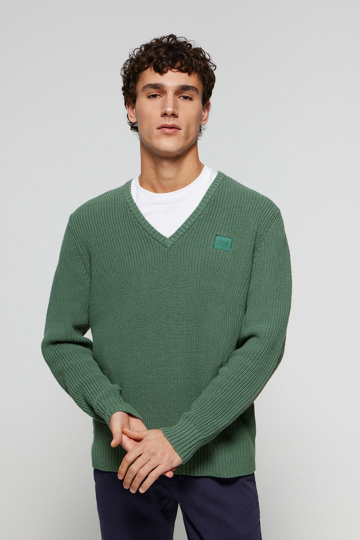 Maglione verde in maglia spessore 9 con particolare Polo Club